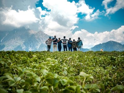 Young friends on top of a mountain enjoying the mesmerizing view